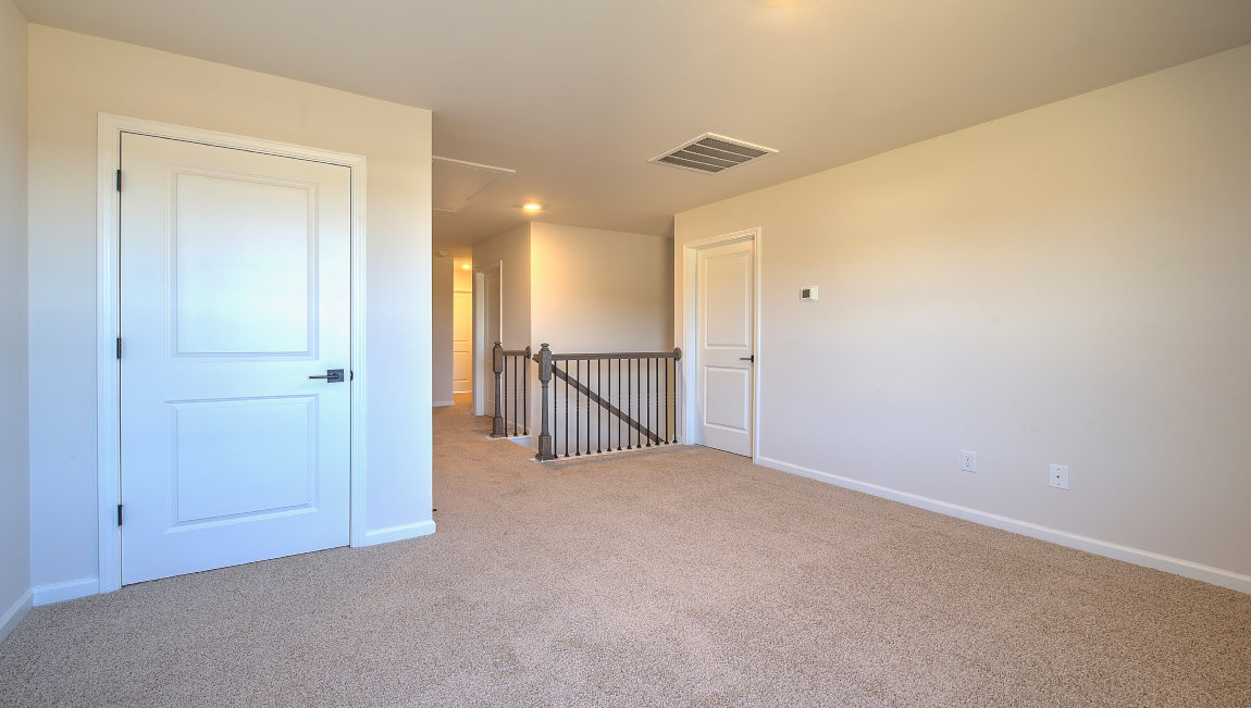 Upstairs carpeted loft area
