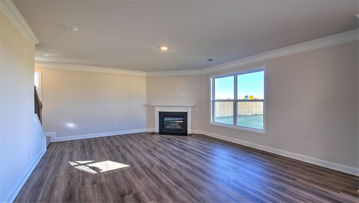 Family room with fireplace and large window