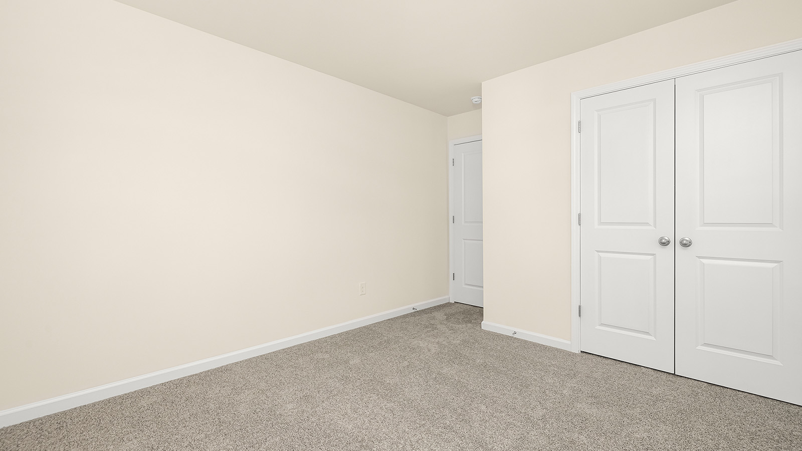 Carpeted bedroom with medium window