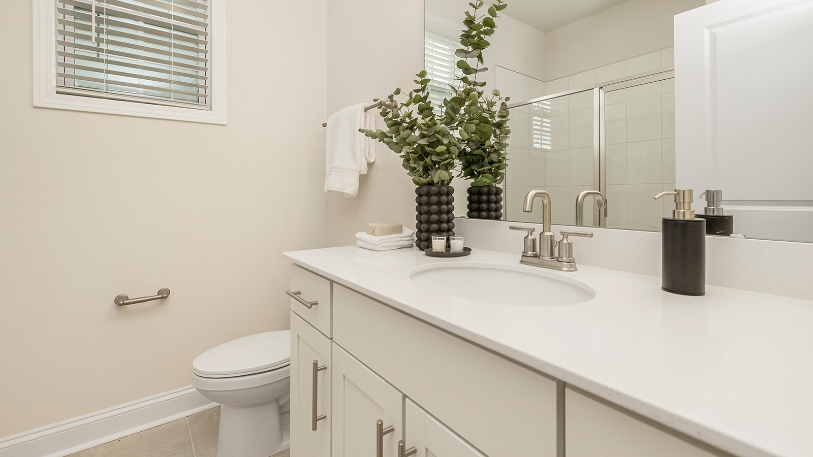 Bathroom with white cabinets and shower tub combination