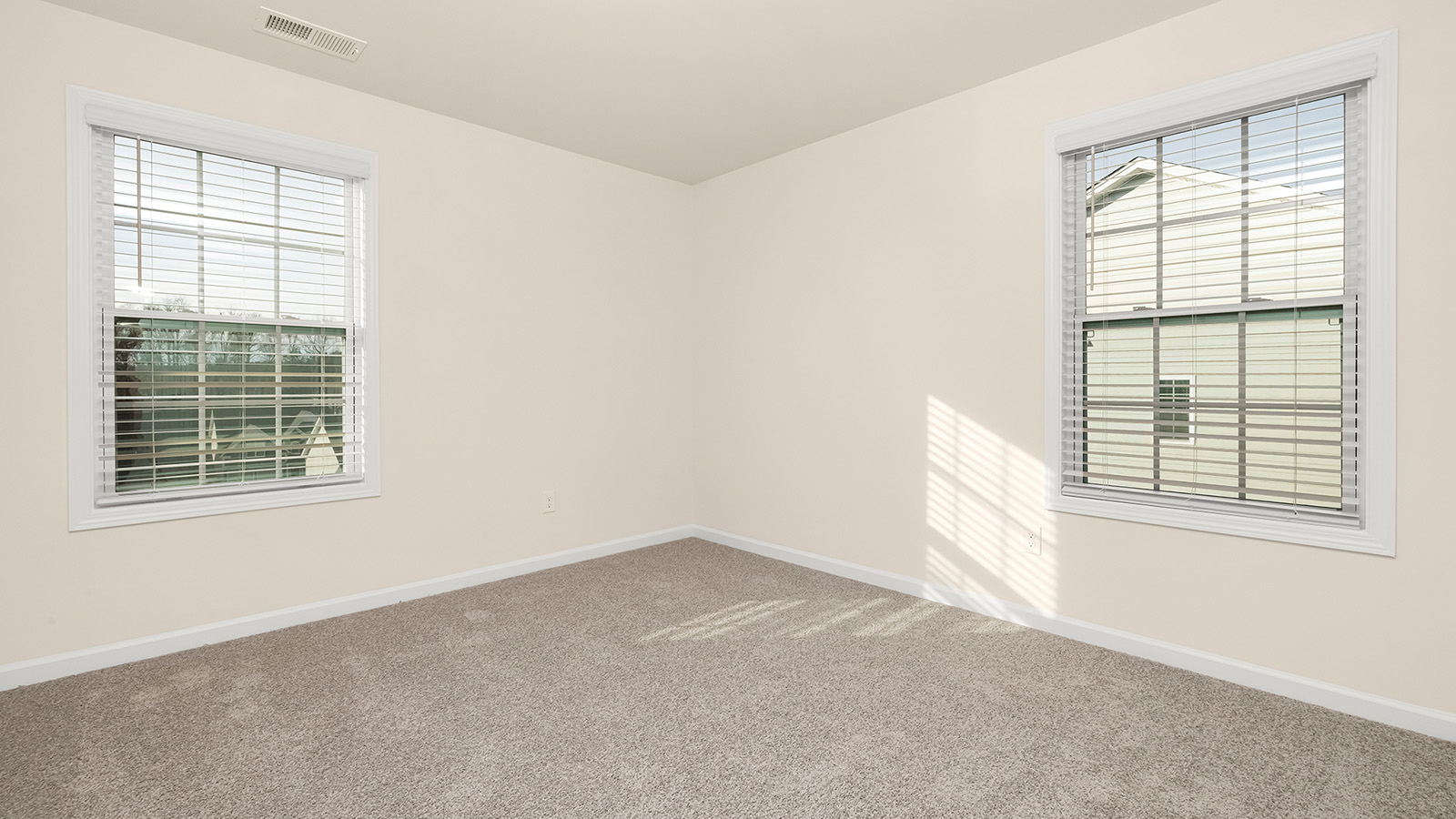 Carpeted bedroom with medium window