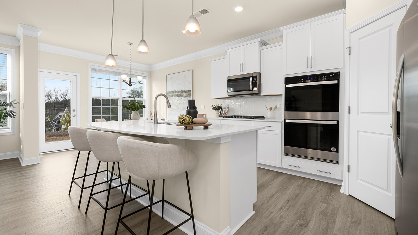 Kitchen and island with white cabinets