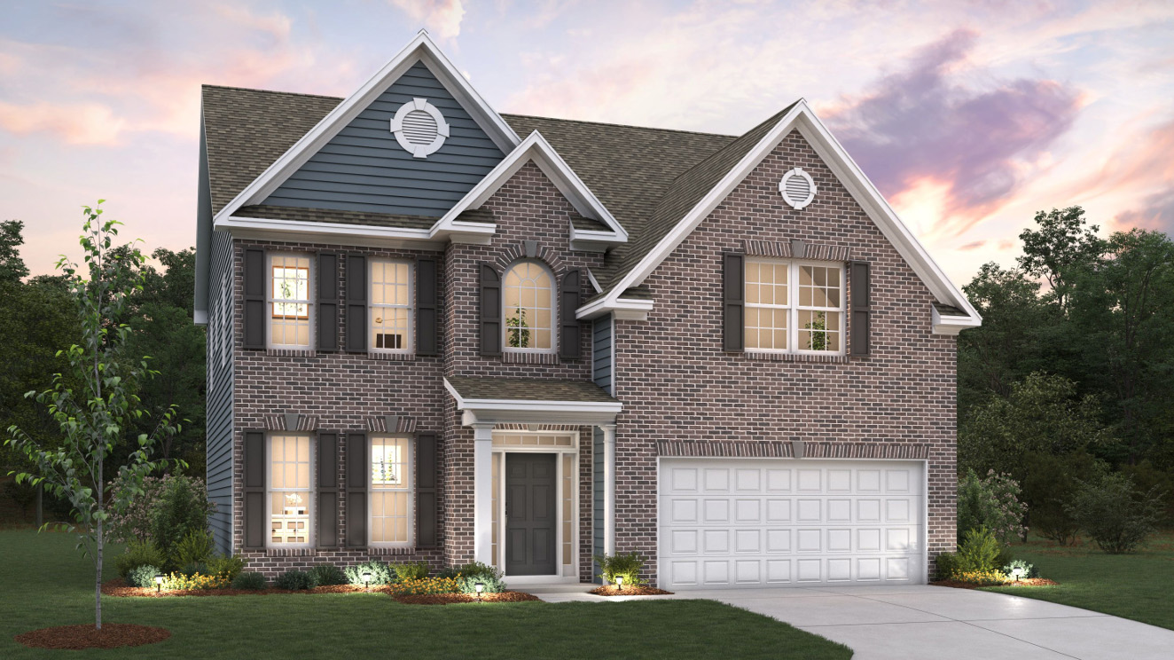 Fleetwood front exterior with brick and siding and two car garage