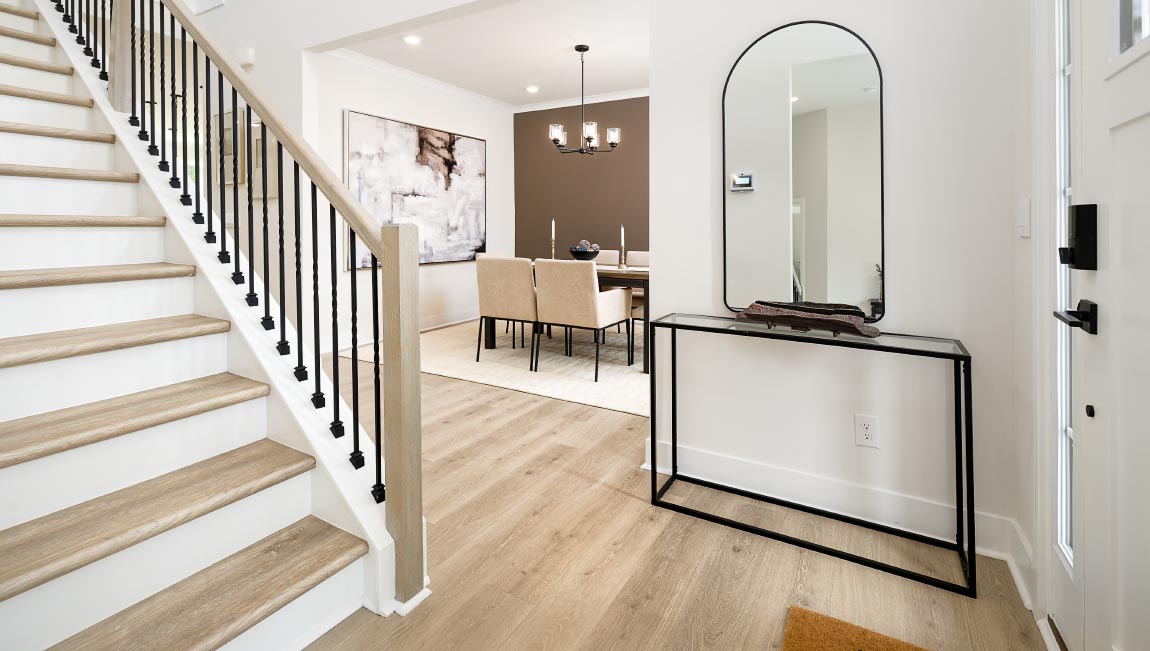 Welcoming foyer, view of stairs and front door