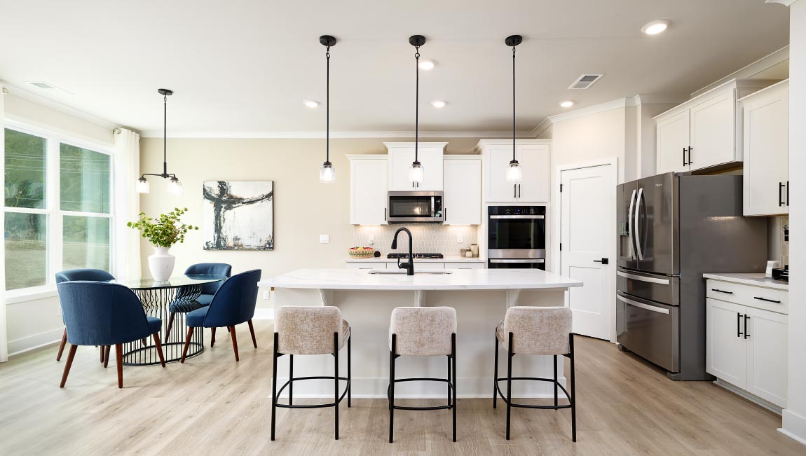 Kitchen and island with white cabinets
