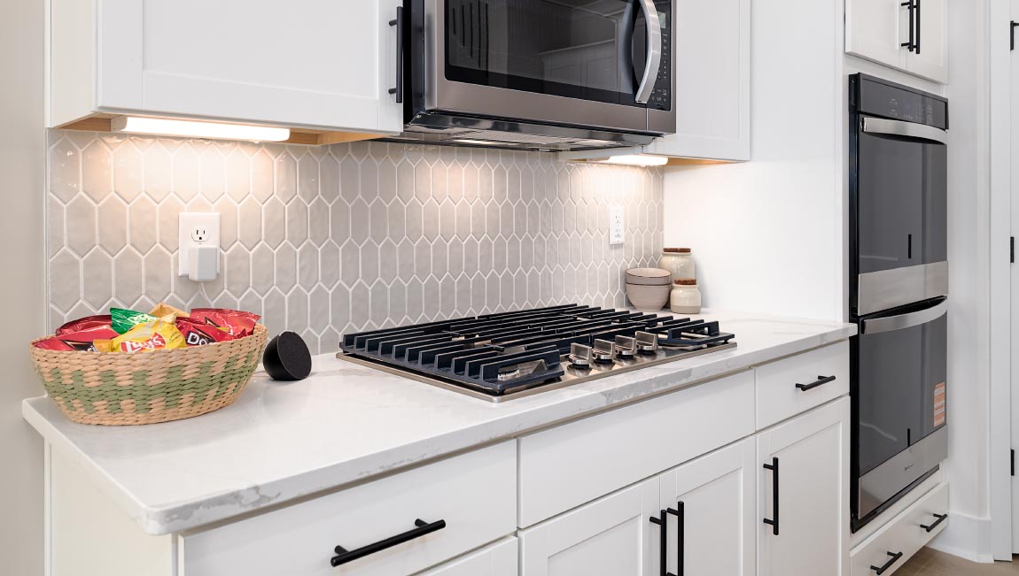 Kitchen and island with white cabinets