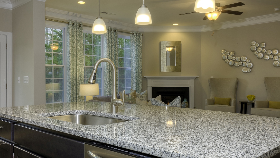 Kitchen and island with white cabinets
