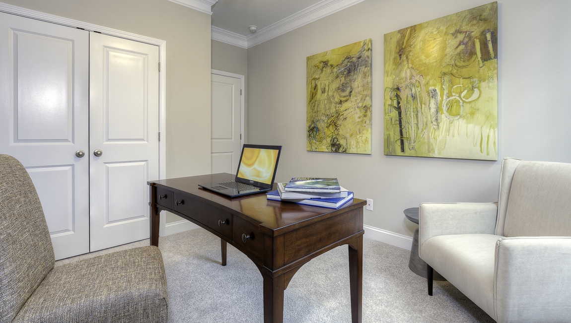 Carpeted bedroom with medium window