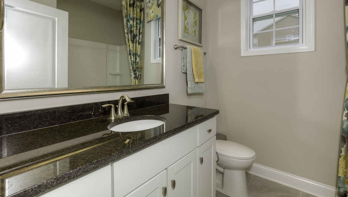 Bathroom with white cabinets
