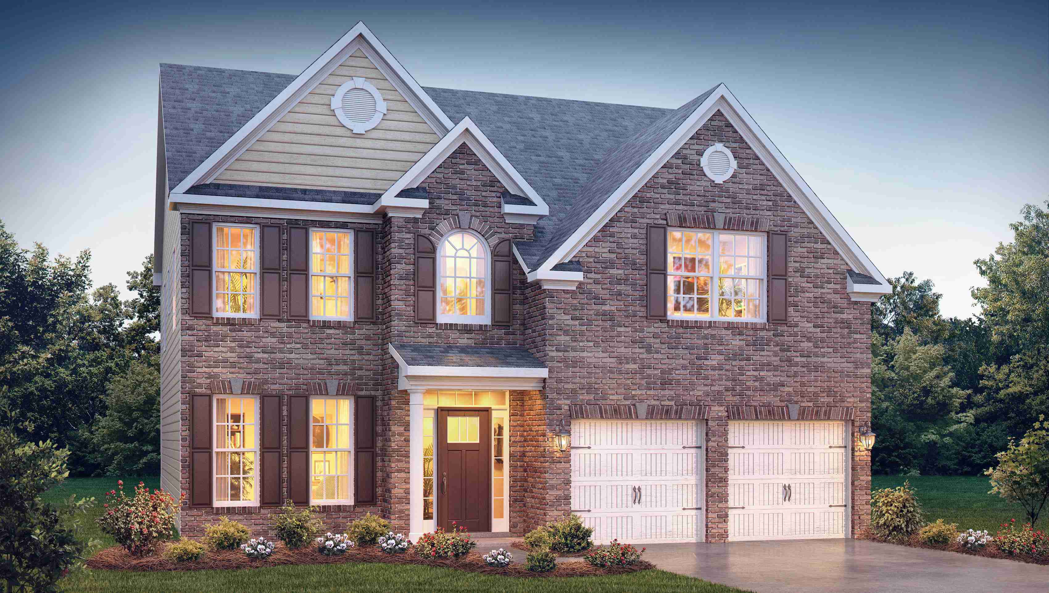 Fleetwood front exterior with brick and siding and two car garage