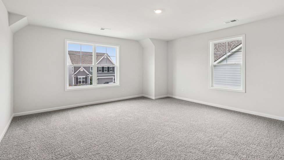 Upstairs Recreational room with carpet and two small windows