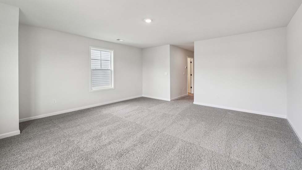 Upstairs Recreational room with carpet and two small windows