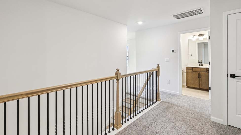 Upstairs Recreational room with carpet and two small windows