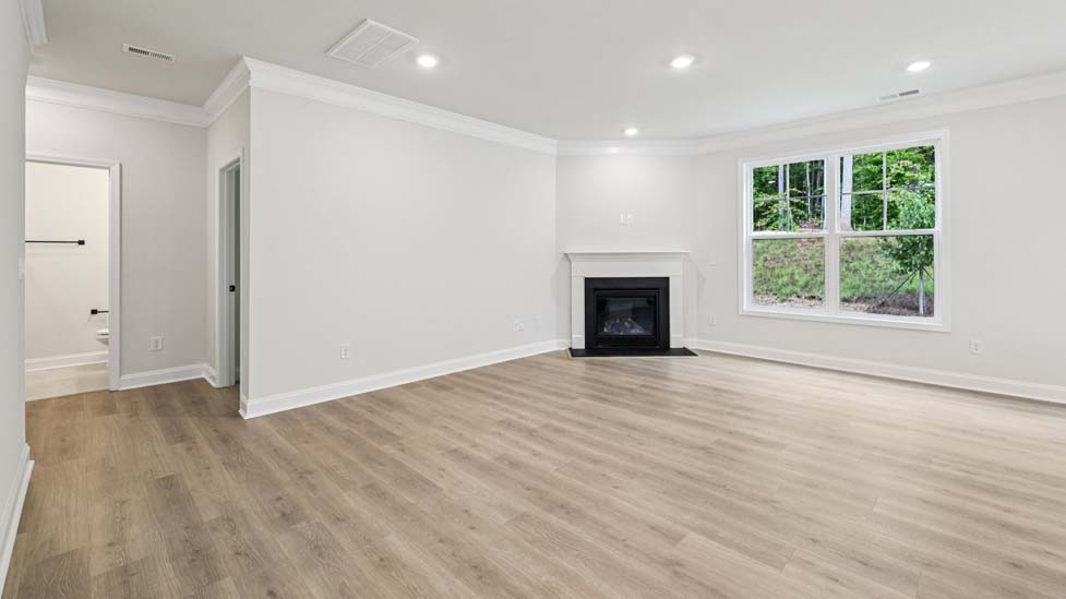 Family room with large window and fireplace