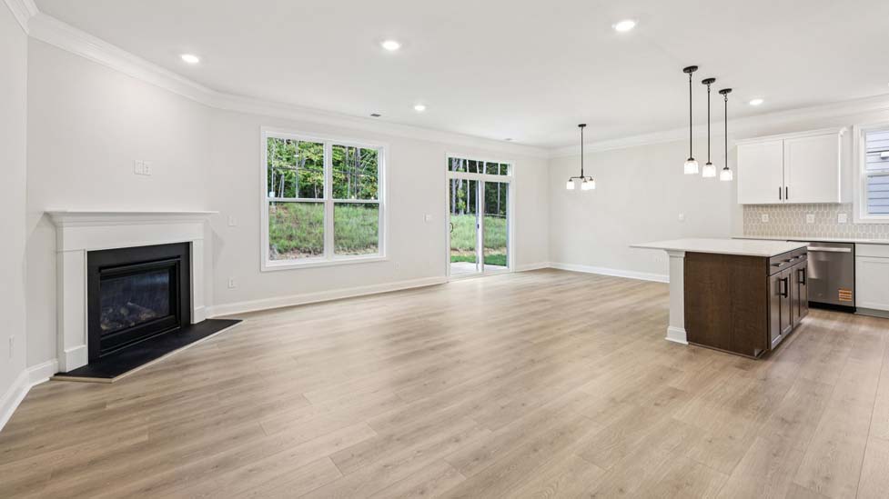 Family room with large window and fireplace