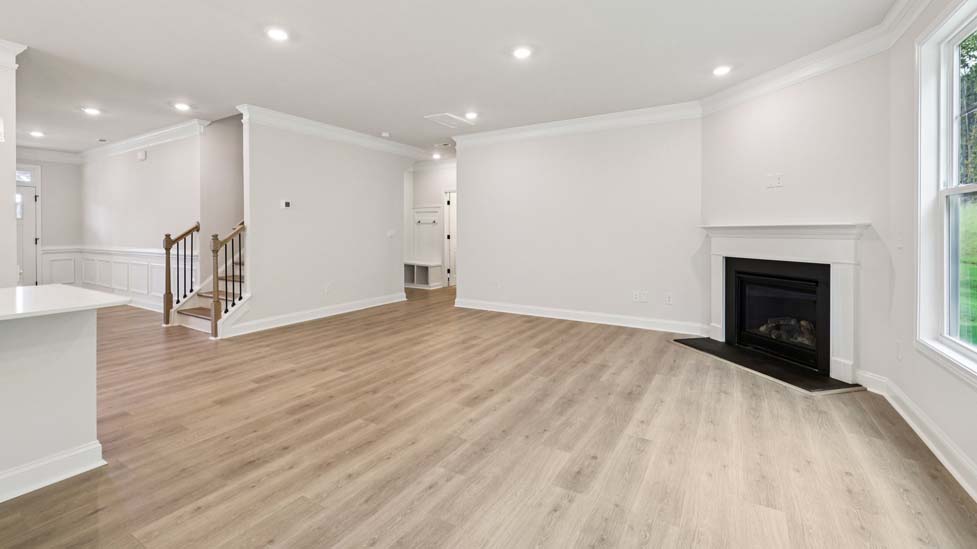 Family room with large window and fireplace
