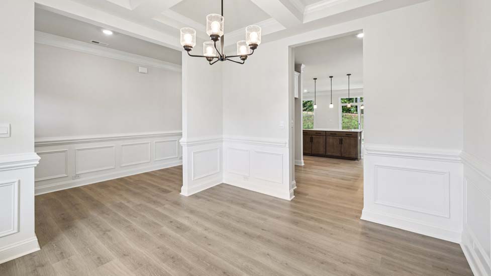 Dining room area with large windows and wood floors