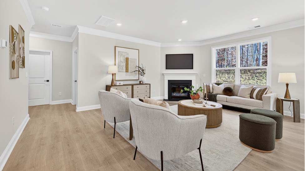 Family room with large window and fireplace