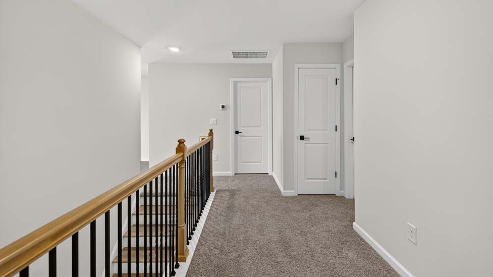 Upstairs landing area with carpet