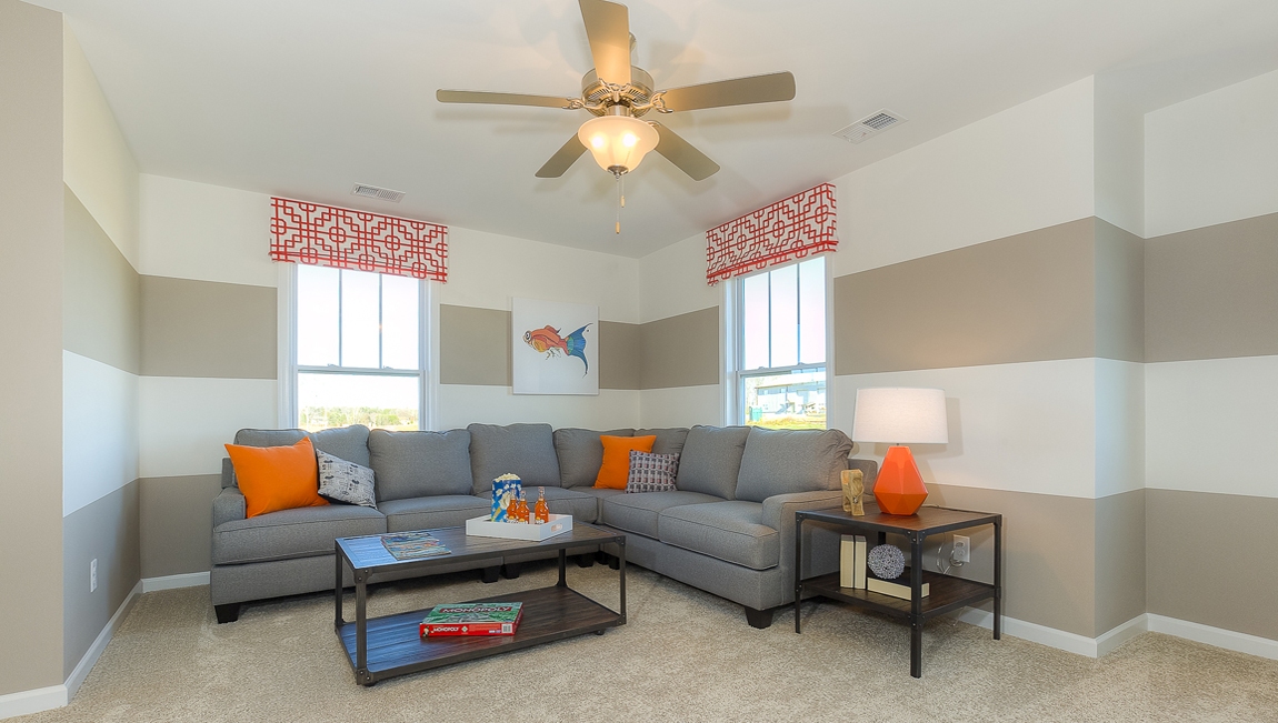Upstairs Recreational room with carpet and two small windows