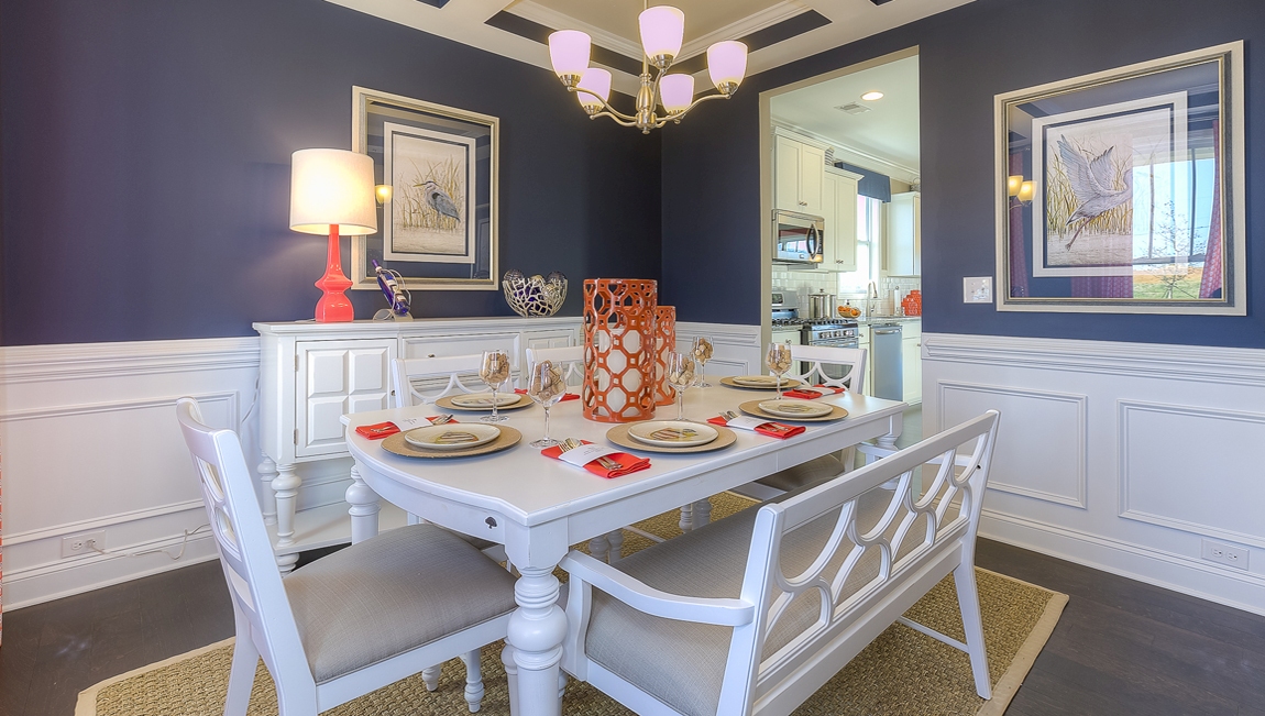 Dining room area with large windows and wood floors