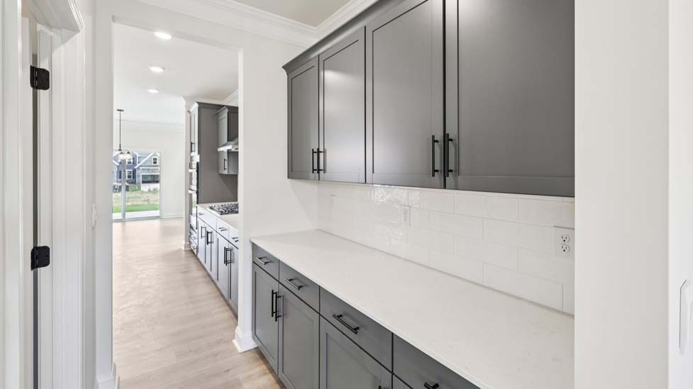 Kitchen and island with stainless steel appliances