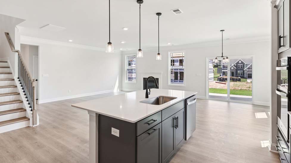 Kitchen and island with stainless steel appliances