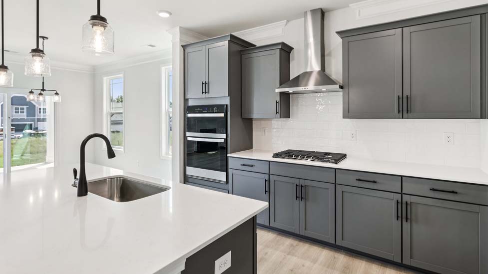 Kitchen and island with stainless steel appliances