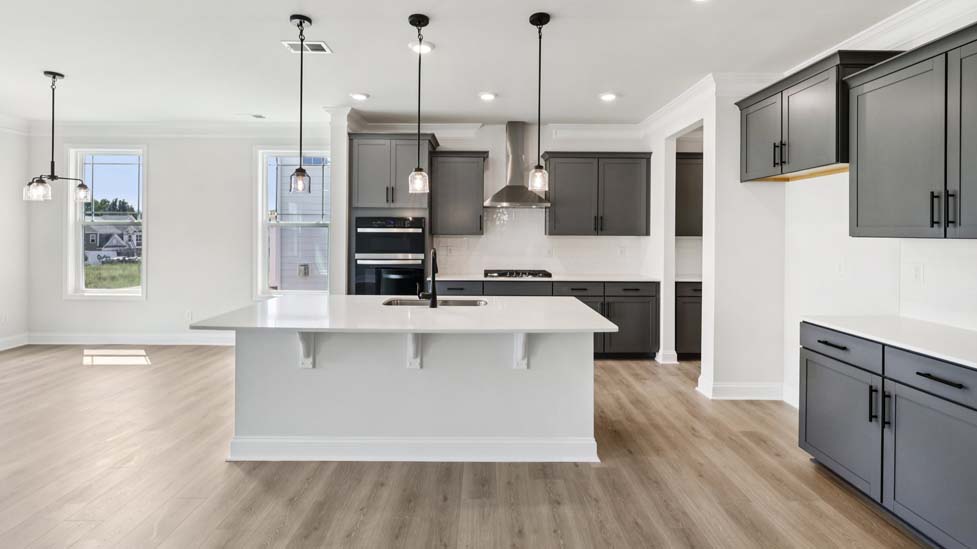 Kitchen and island with stainless steel appliances