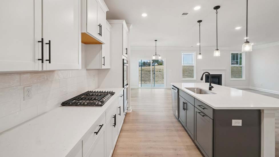 Kitchen and island with stainless steel appliances