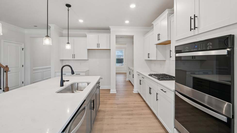 Kitchen and island with stainless steel appliances
