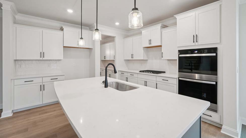 Kitchen and island with stainless steel appliances
