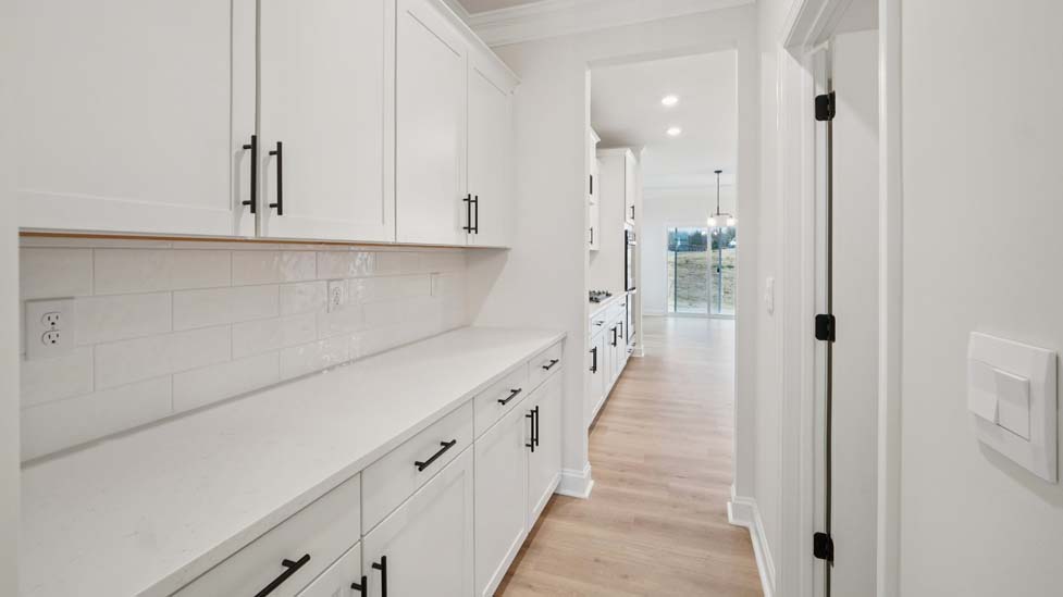 Kitchen and island with stainless steel appliances