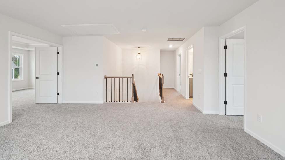 Carpeted bedroom with window