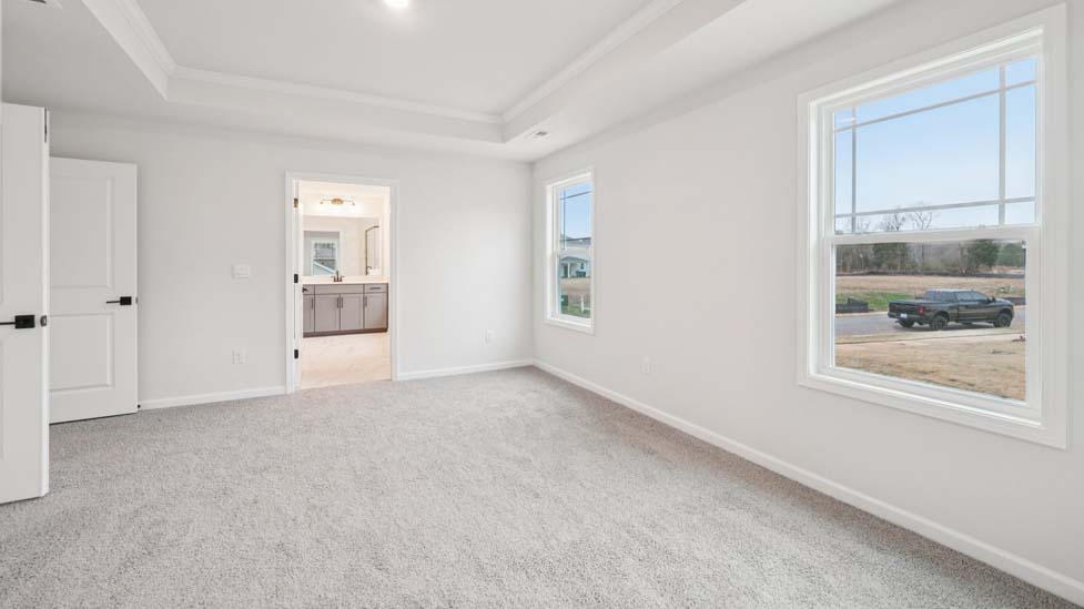 Primary bedroom with windows