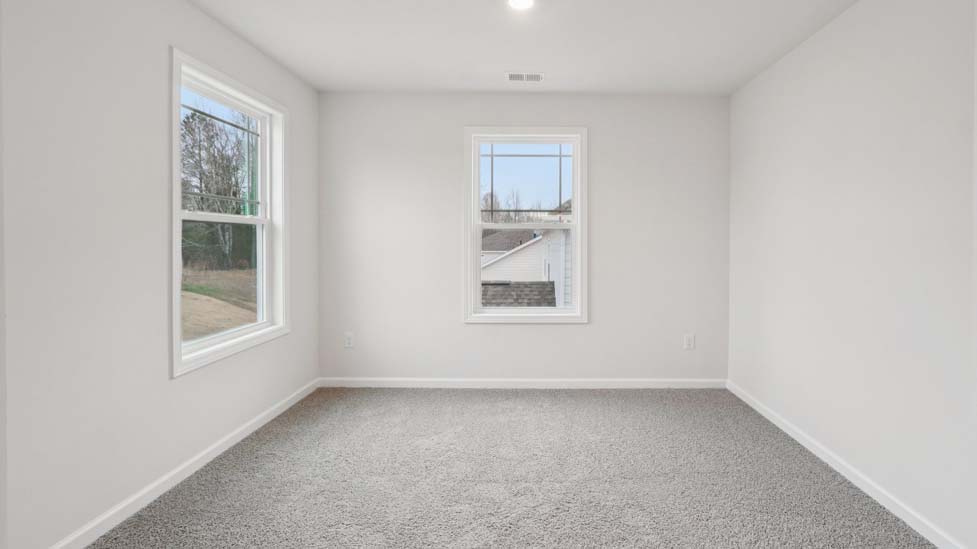 Primary bedroom with windows