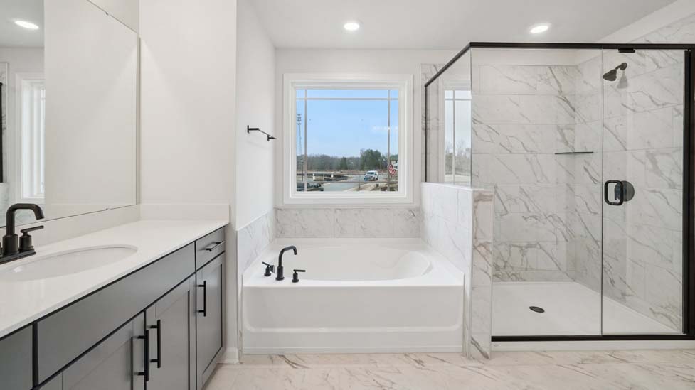Primary bathroom with standing glass shower