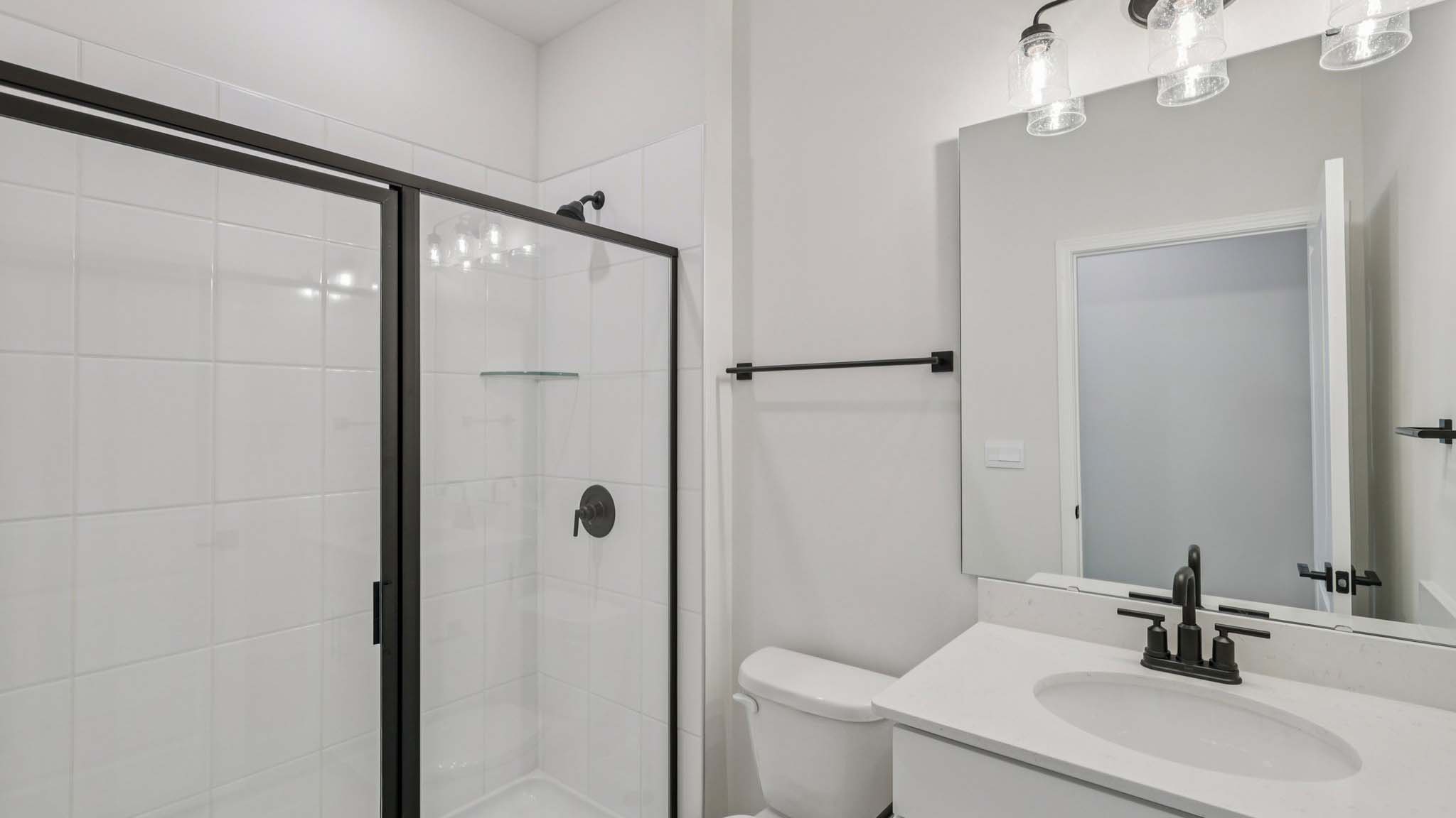Bathroom with standing glass shower
