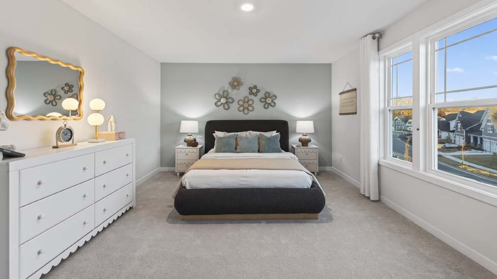 Carpeted bedroom with window