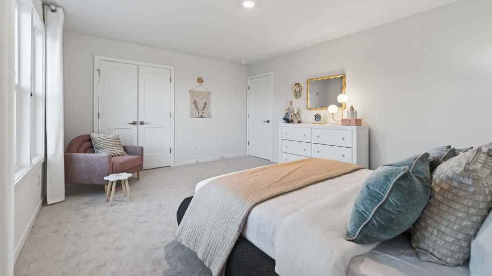 Carpeted bedroom with window