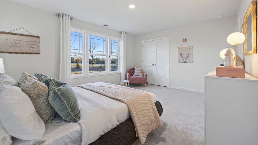 Carpeted bedroom with window