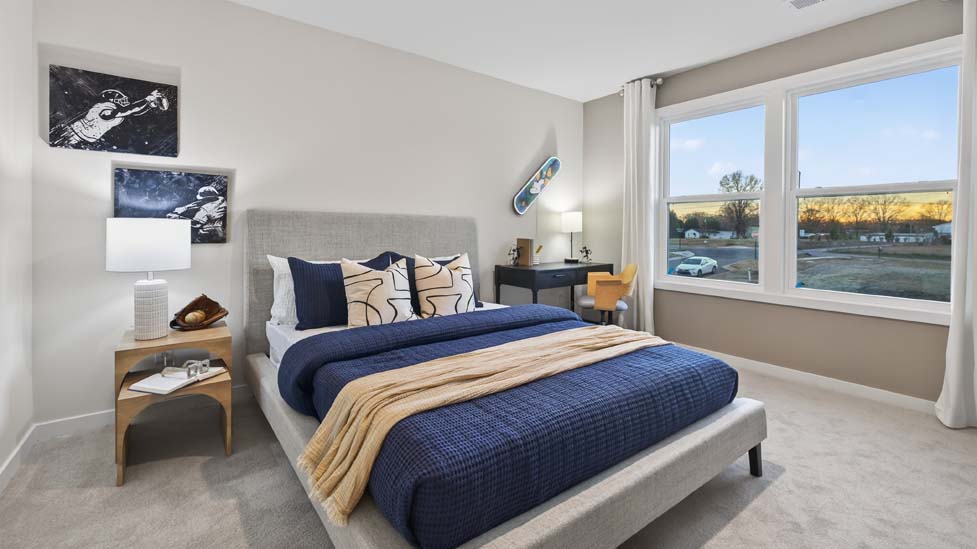 Carpeted bedroom with window