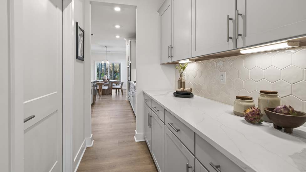 Kitchen and island with stainless steel appliances