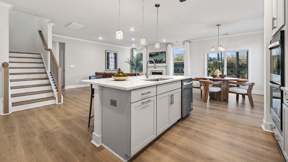 Kitchen and island with stainless steel appliances