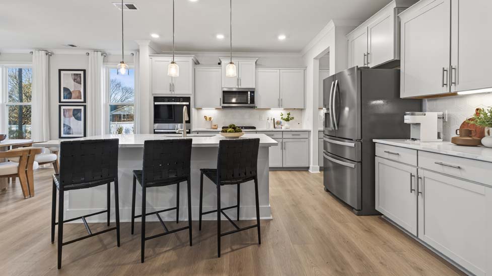 Kitchen and island with stainless steel appliances