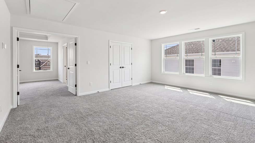 Carpeted bedroom with window