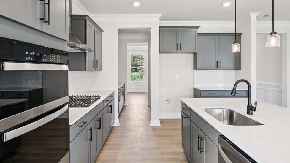 Kitchen and island with stainless steel appliances