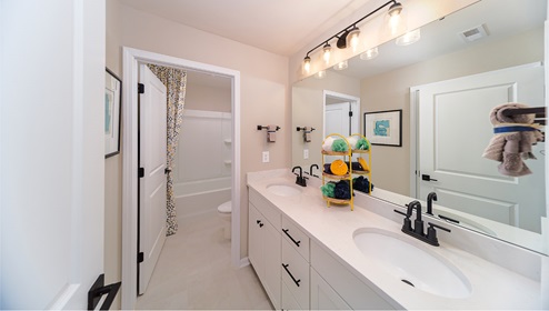 Bathroom with double sinks, and separate toilet and bathtub room