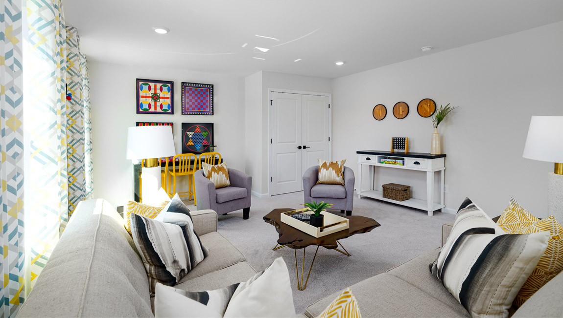 Loft space with carpet and two large windows