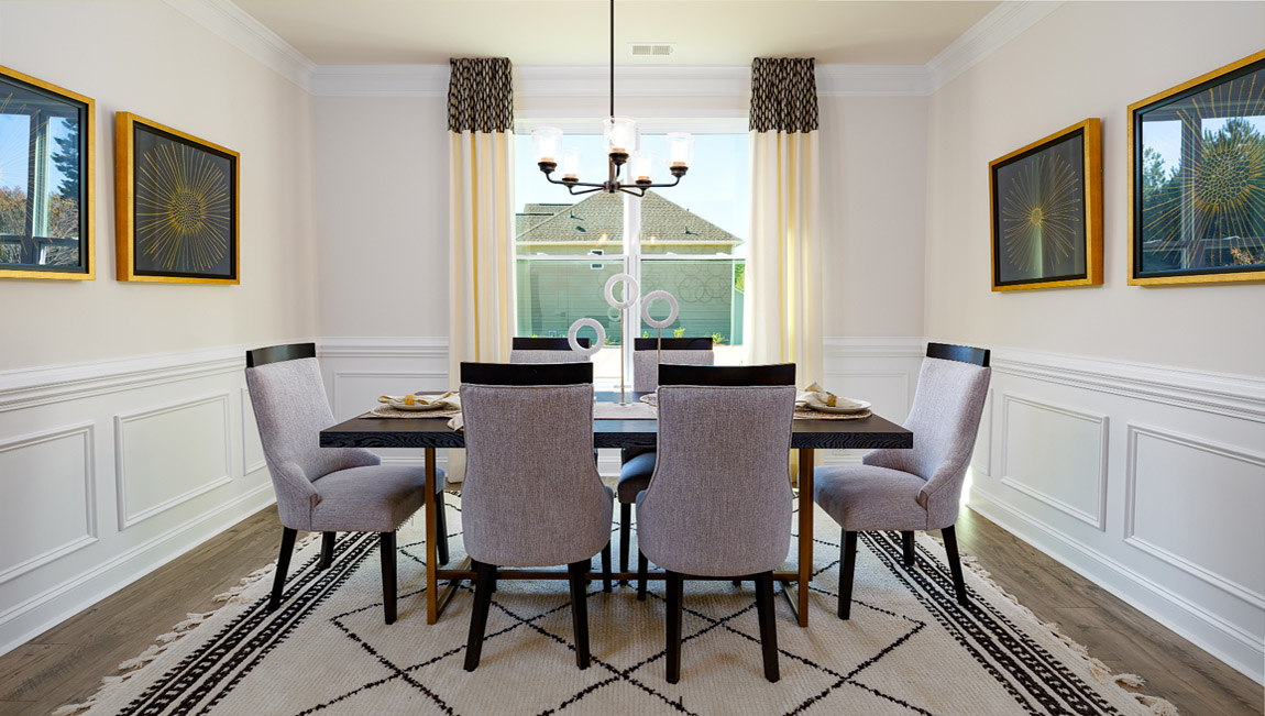 Dining room with wood floors and large window